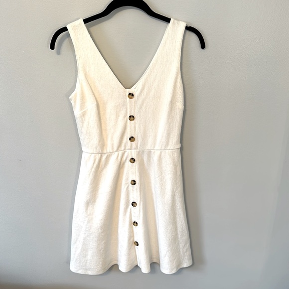 White dress with buttons. Mid length.Fitted on top. Very soft material! - Picture 1 of 5